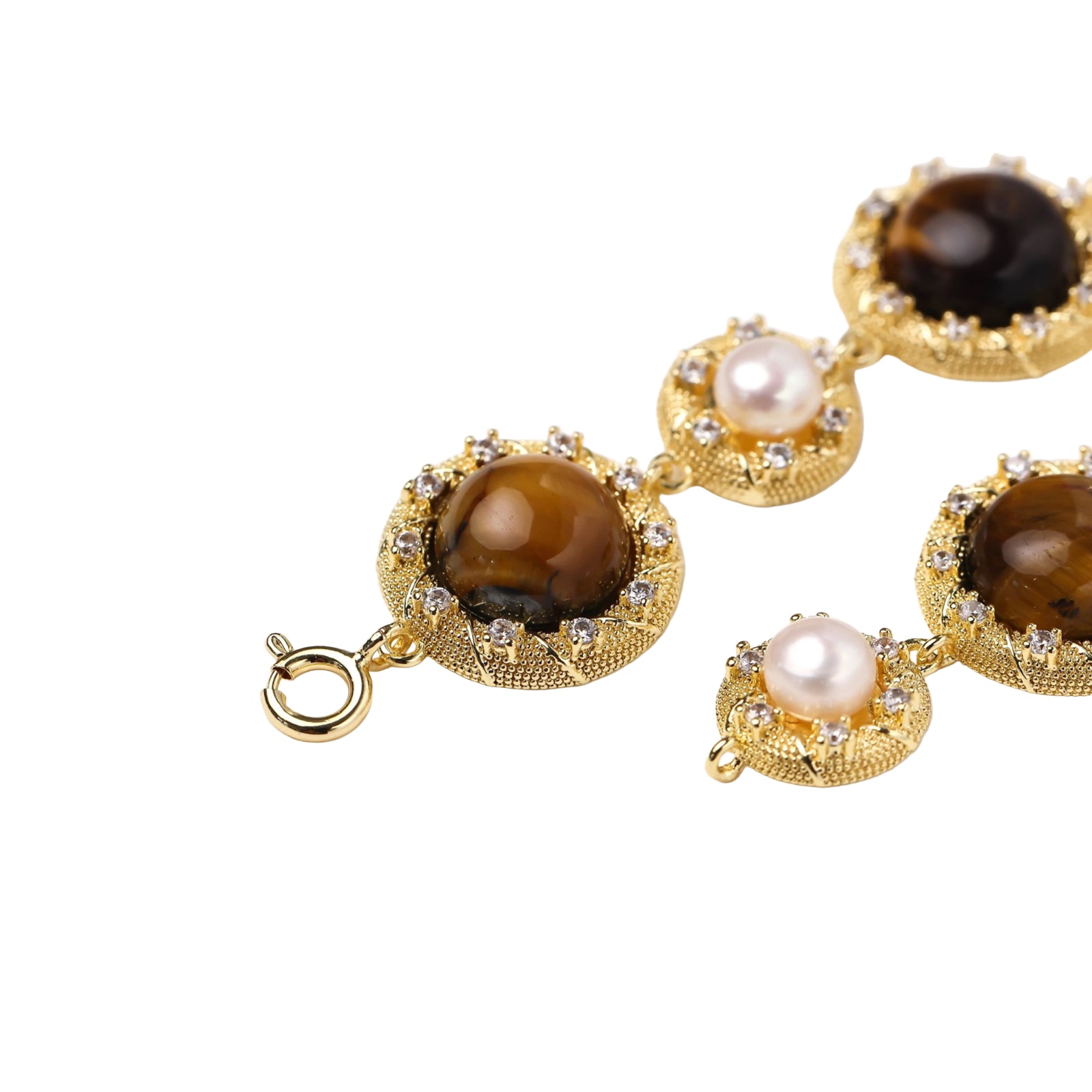 Gold-plated link bracelet with alternating brown tiger's eye stones and white freshwater pearls in ornate bezels.
