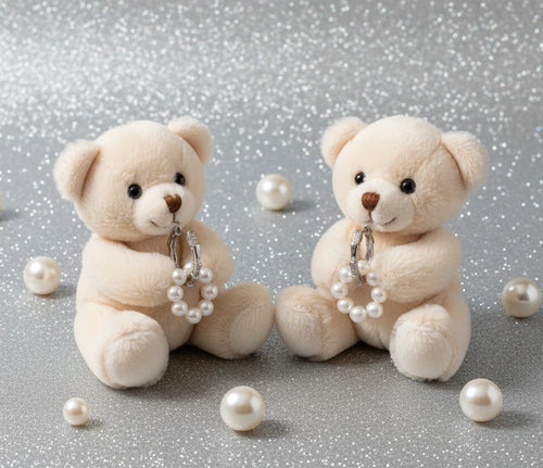 Rhodium-plated silver hoop earrings with freshwater pearls arranged in crescent formation and diamond accents