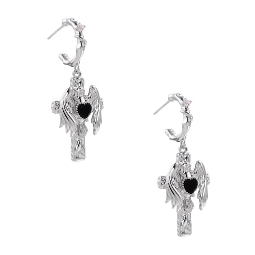 Silver drop earrings with twisted hoops and angel wings embracing black heart locket on white background.